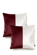 Two square throw pillows with a vertical split design in deep burgundy and white, shown on a clean white background.