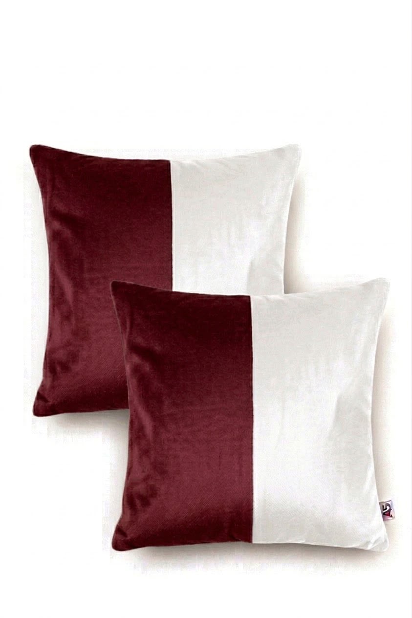 Two square throw pillows with a vertical split design in deep burgundy and white, shown on a clean white background.