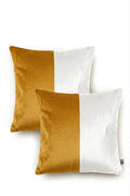 Two square throw pillows with a vertical color-blocked design in mustard yellow and white, shown on a clean white background.
