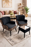 Modern living room with leopard print chairs and ottoman, white sofa, and decorative items.