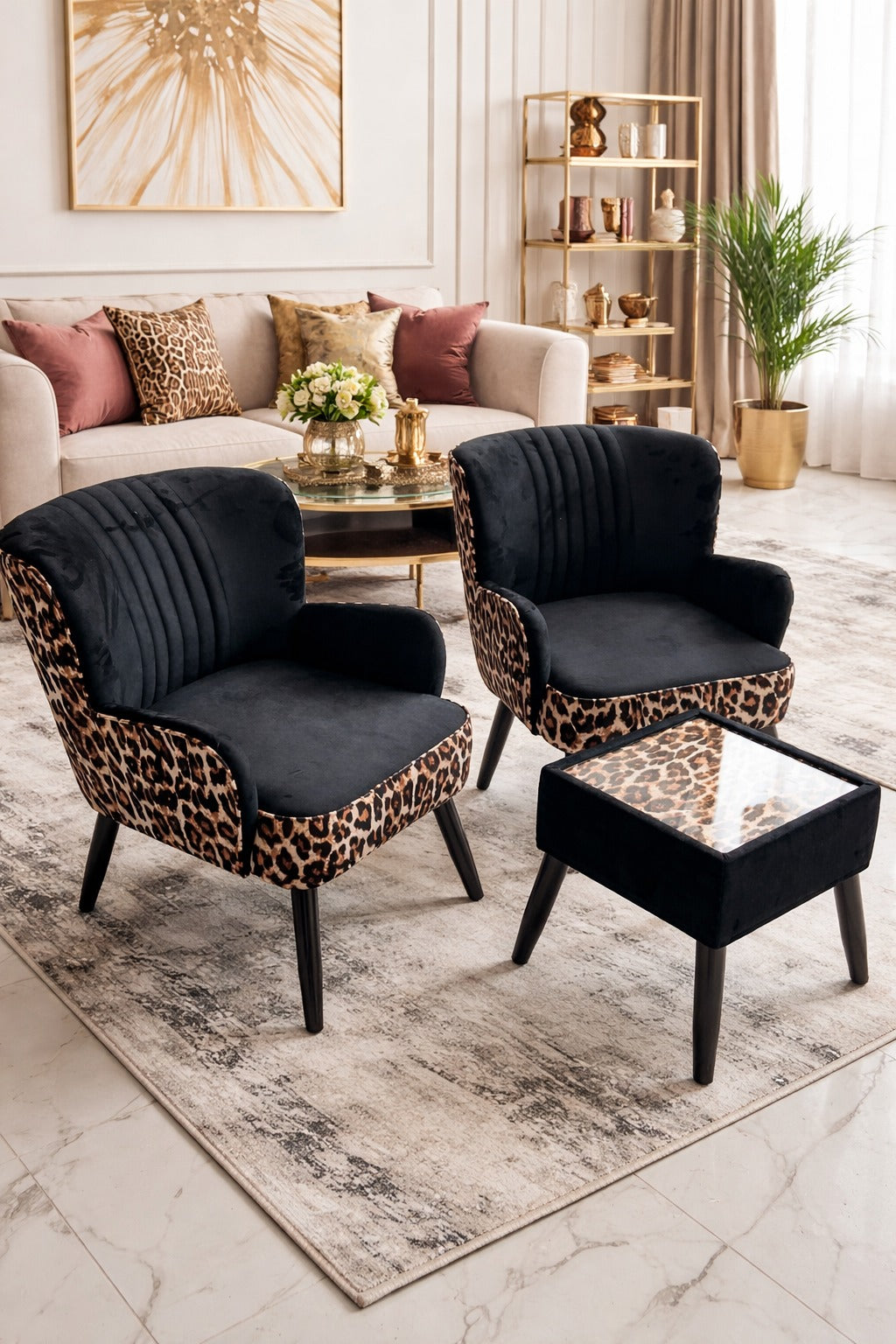 Modern living room with leopard print chairs and ottoman, white sofa, and decorative items.