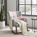 A modern rocking armchair with patchwork upholstery in light gray, blush pink, and off-white, with dark wood rockers. A cream throw blanket is draped over the chair in a bright, contemporary room with a large window, a potted cactus, and a small side table.